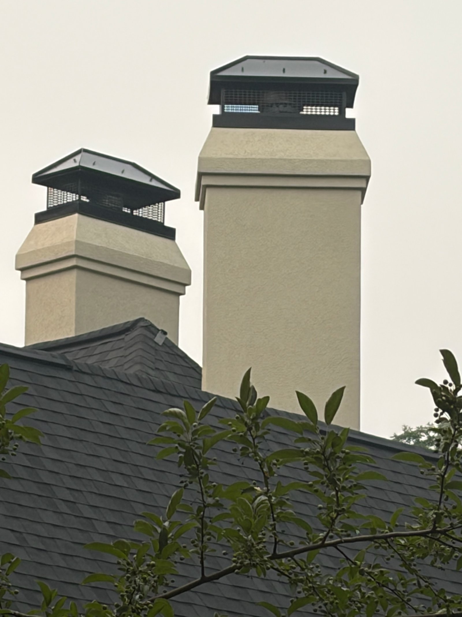 Custom black chimney caps from distance